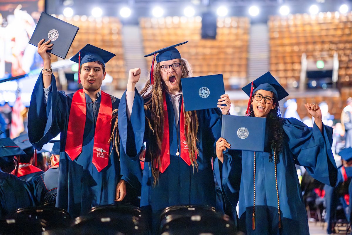 Three MSU Denver students holding up diplomas