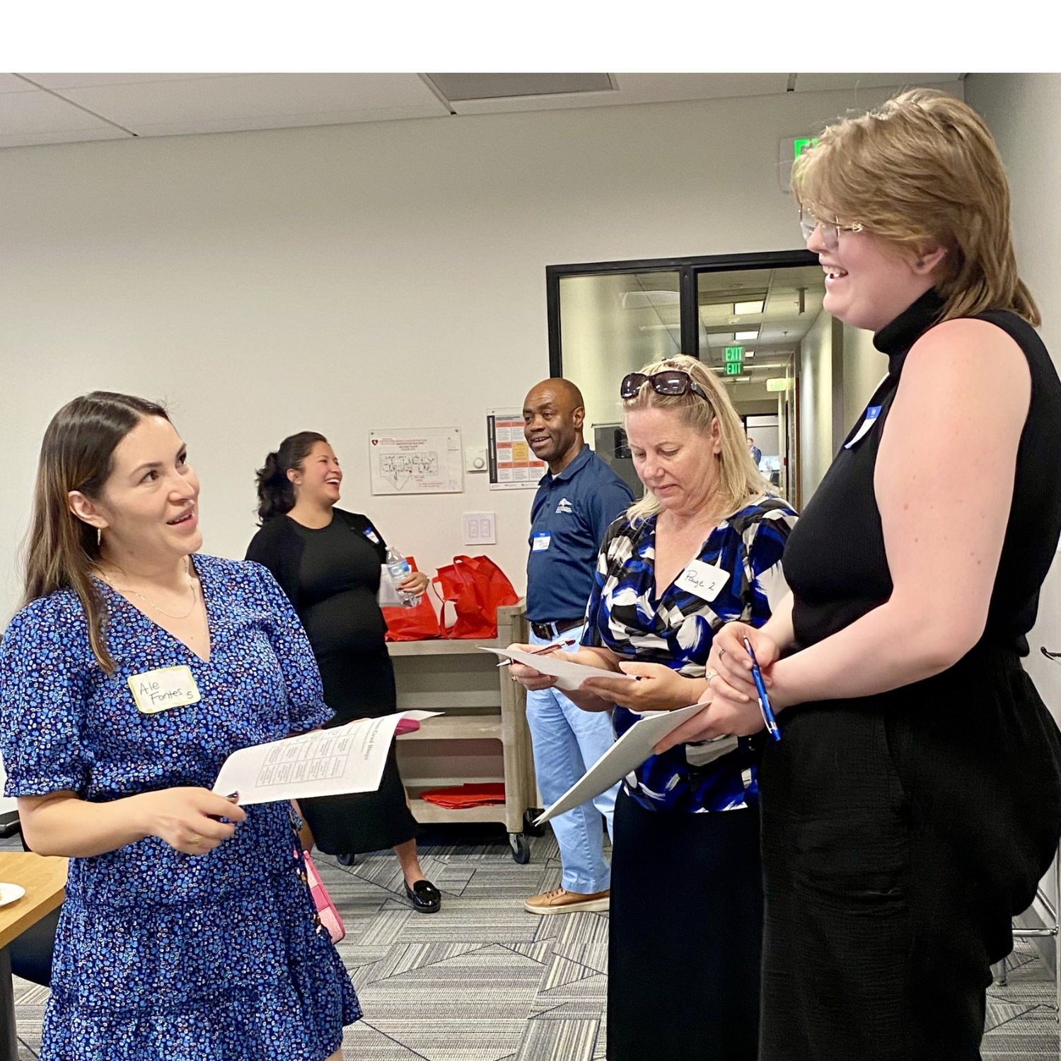 a photo from the MPAcc orientation for Fall 2025 - 3 students networking