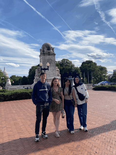 A group of four young people at Union Station in DC.