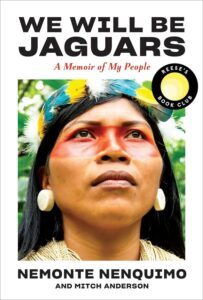 Cover of We Will Be Jaguars by Nemonte Nemquimo. The cover shows Nemonte an Indigneous woman looking fiercely in the distance with feathers in her hair and red paint across her eyes.