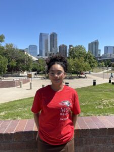 Photo of Bella in front of the Auraria campus