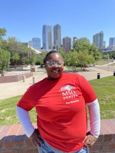 Photo of JaMya in front of the Auraria campus
