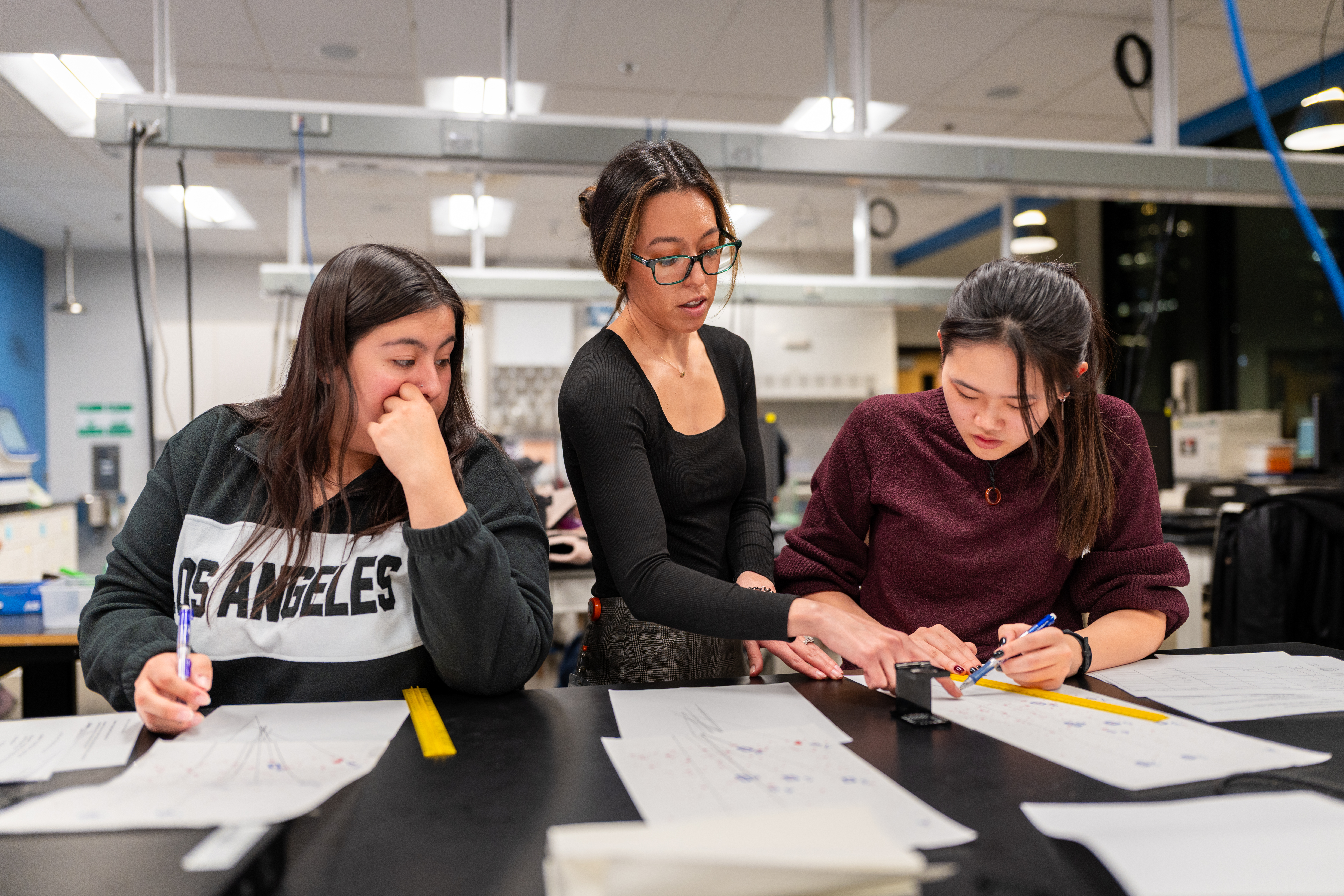 Professor with 2 students