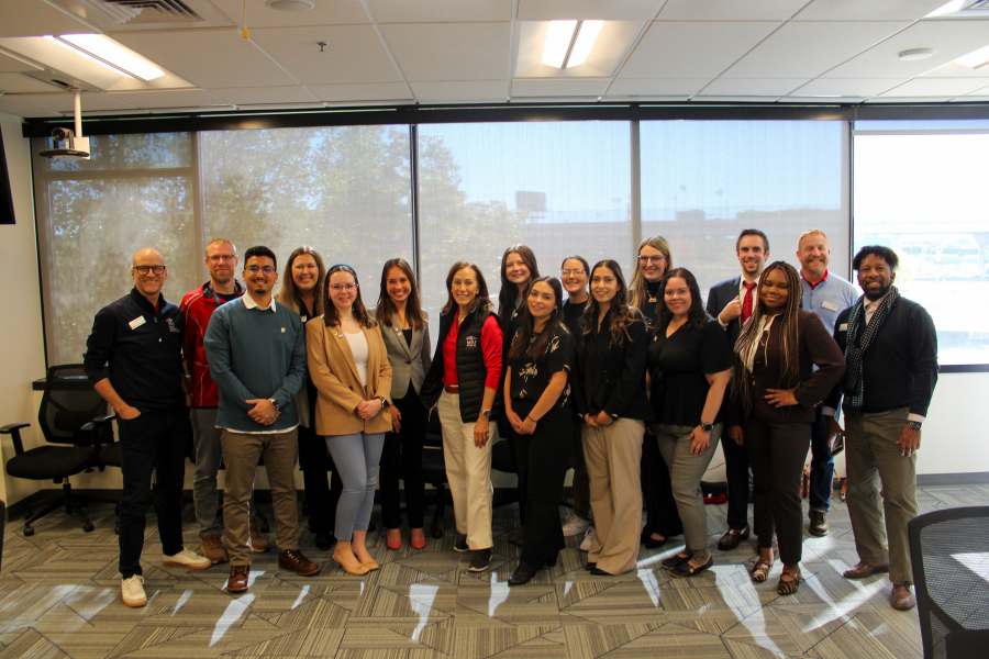 College of Business Student Ambassadors poising a photo with president Davidson