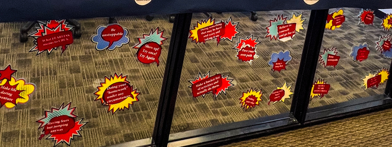 a photo of a wall of quotes from cbus faculty and staff about what being fearless means to them