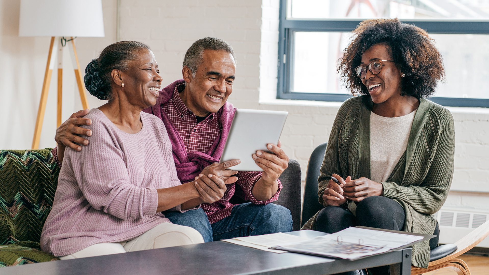 Professional woman consulting with older couple