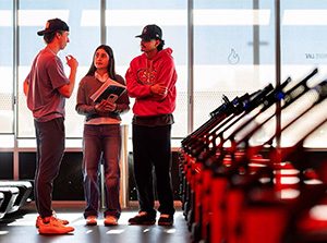 MSU Denver students from left to right Jaden Tomalin, Jasmine Quinones and Barry Vera inspect treadmills at the Orangetheory Fitness in Edgewater. Photo by Josh Geurink