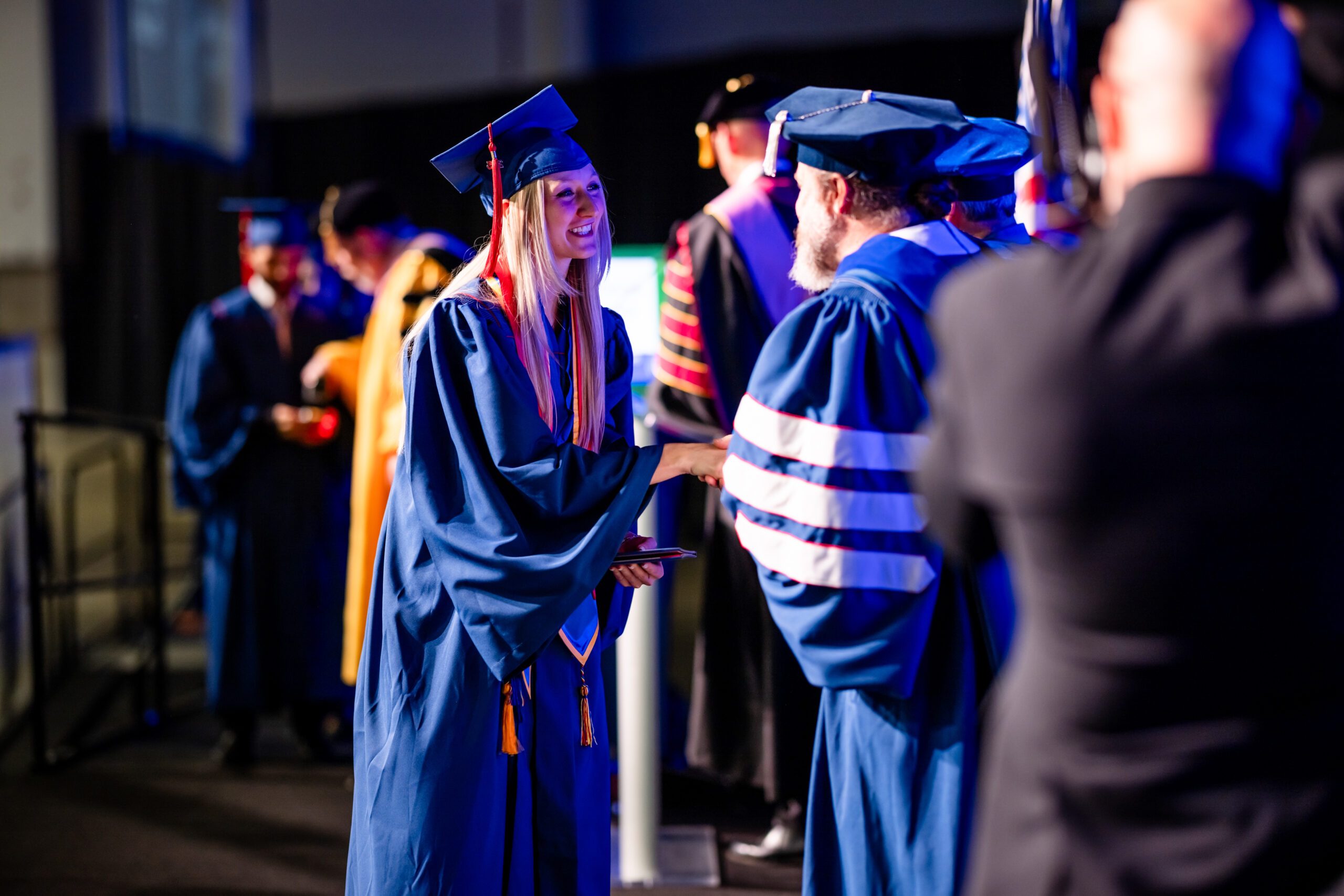 Fall '25 Commencement Ceremony - accounting grad, Autumn, shaking the provost's hand