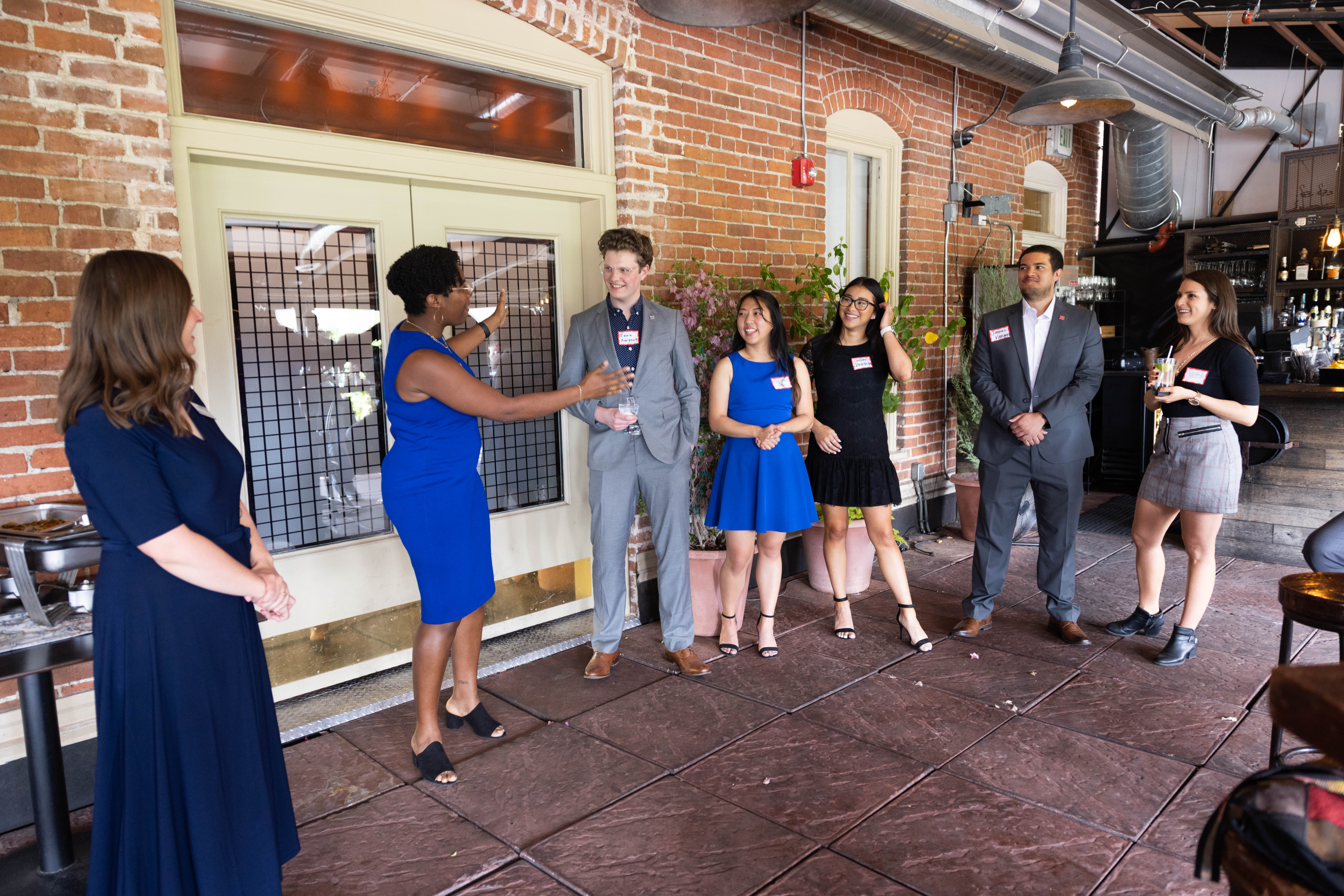 A group of students in business cocktail attire.