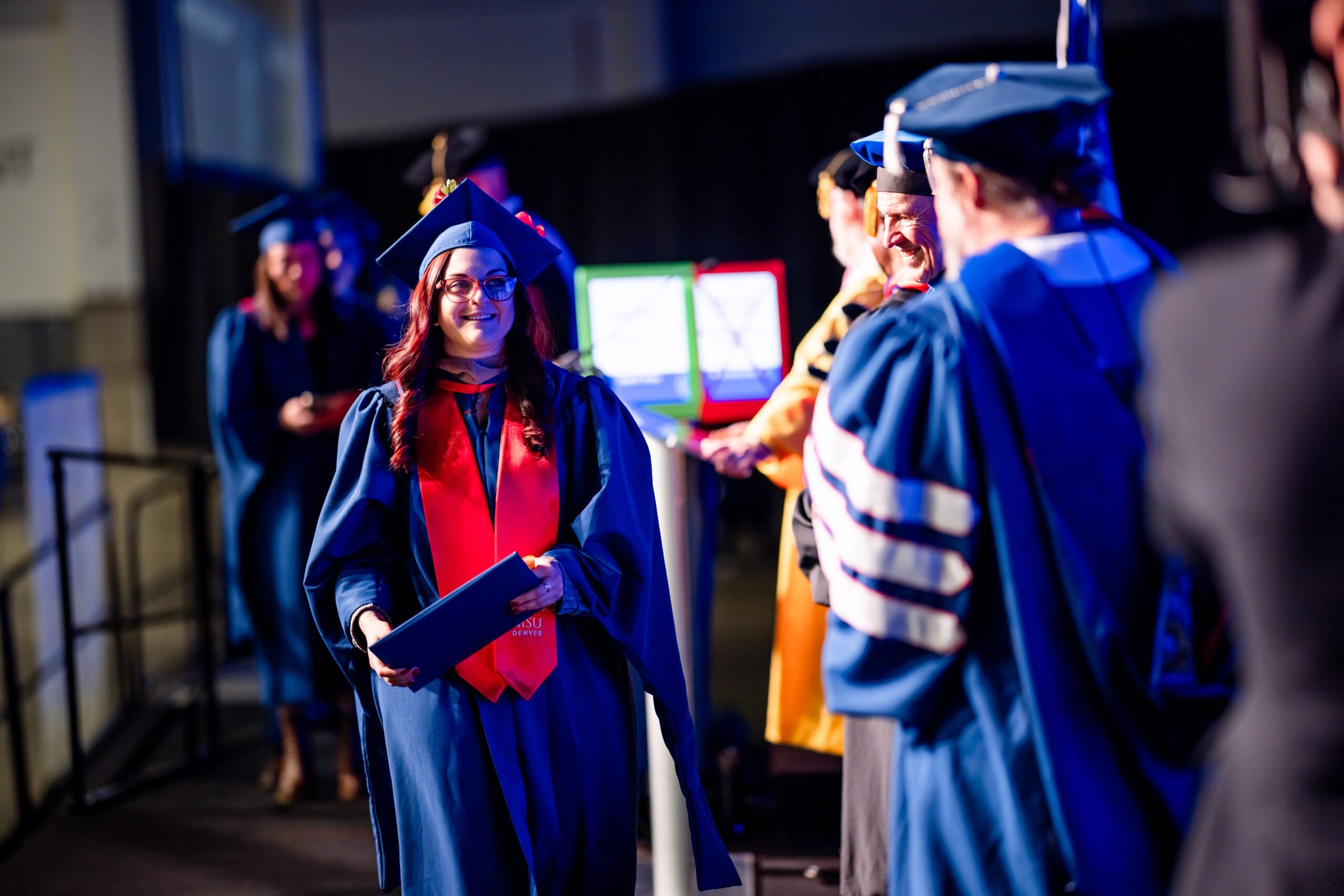 Fall '25 Commencement Ceremony, MPAcc grad, Deja, crossing the stage
