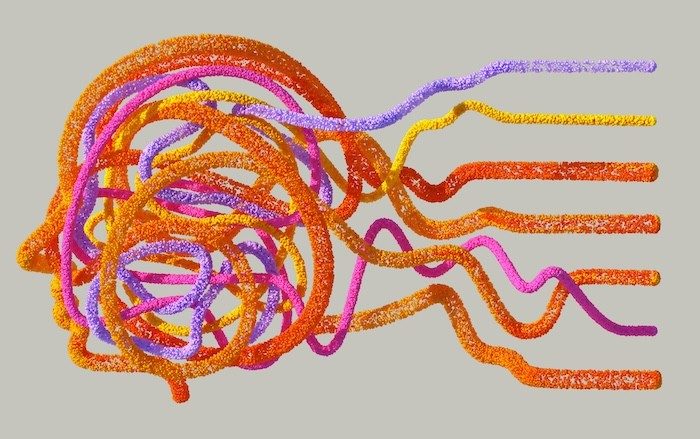 An abstract image of a head with various colors of pipe cleaners coming out, representing ideas