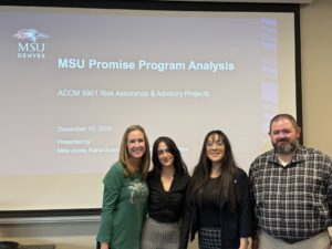 accounting faculty and 3 student internal auditors in front of their intro presentation slide for ACCM 5901 this Fall '25 term