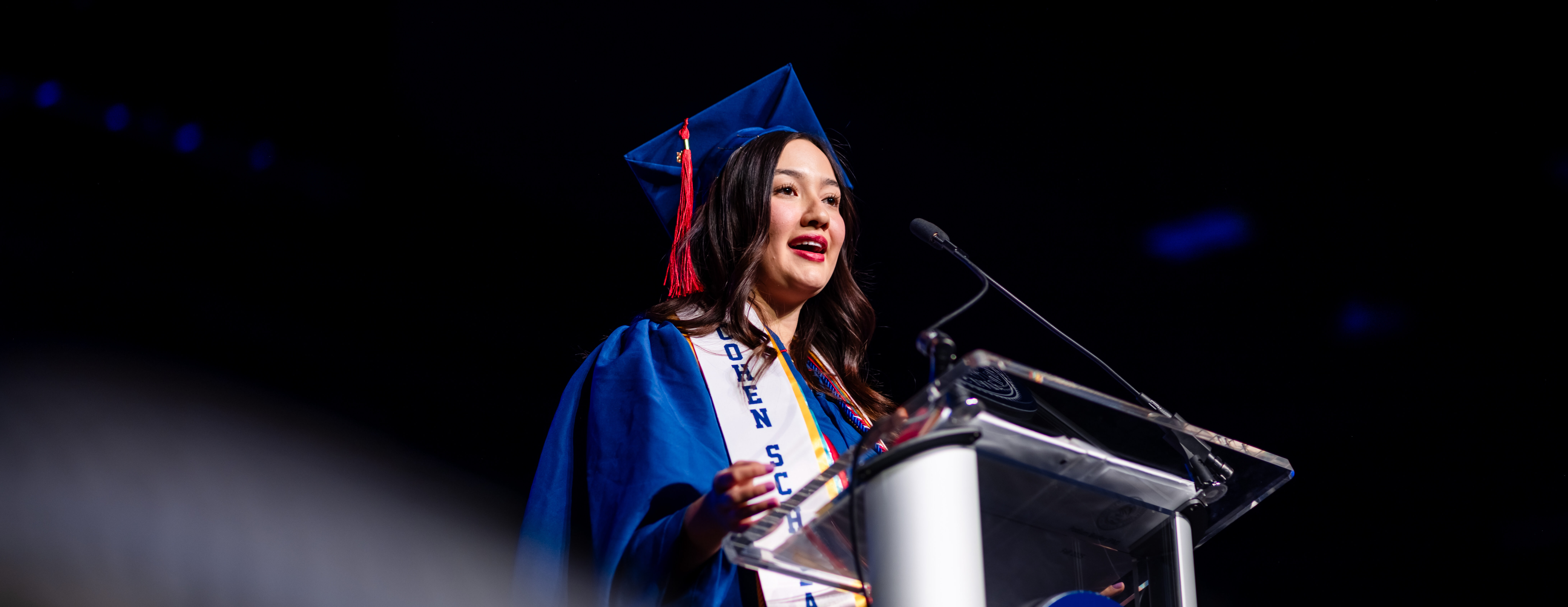 Meidi Reyes speaking during the Fall 2025 Afternoon Commencement