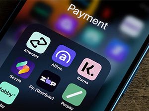 Payment and baking app icons on a smartphone.
