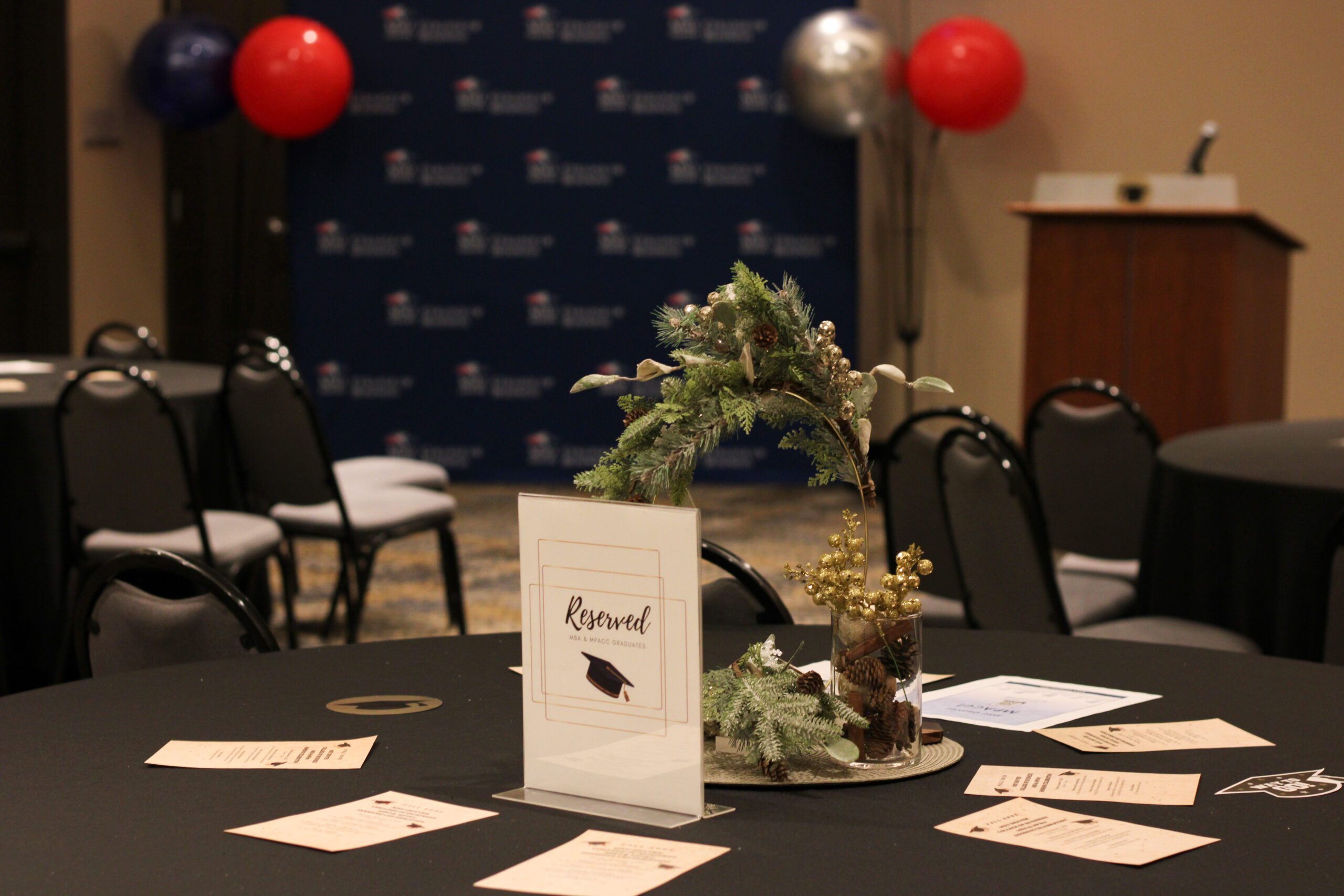 decorated table at Fall '25 MBA & MPAcc hooding celebration