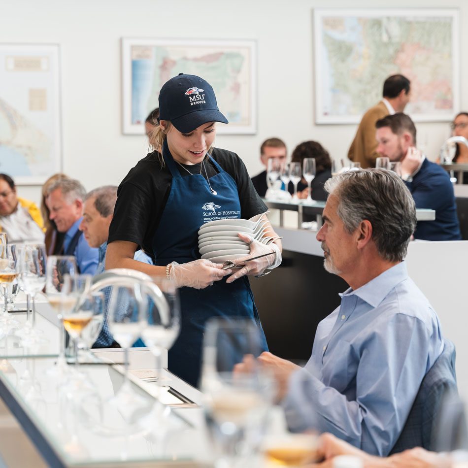 a msudenver server working a business event interacting with a customer