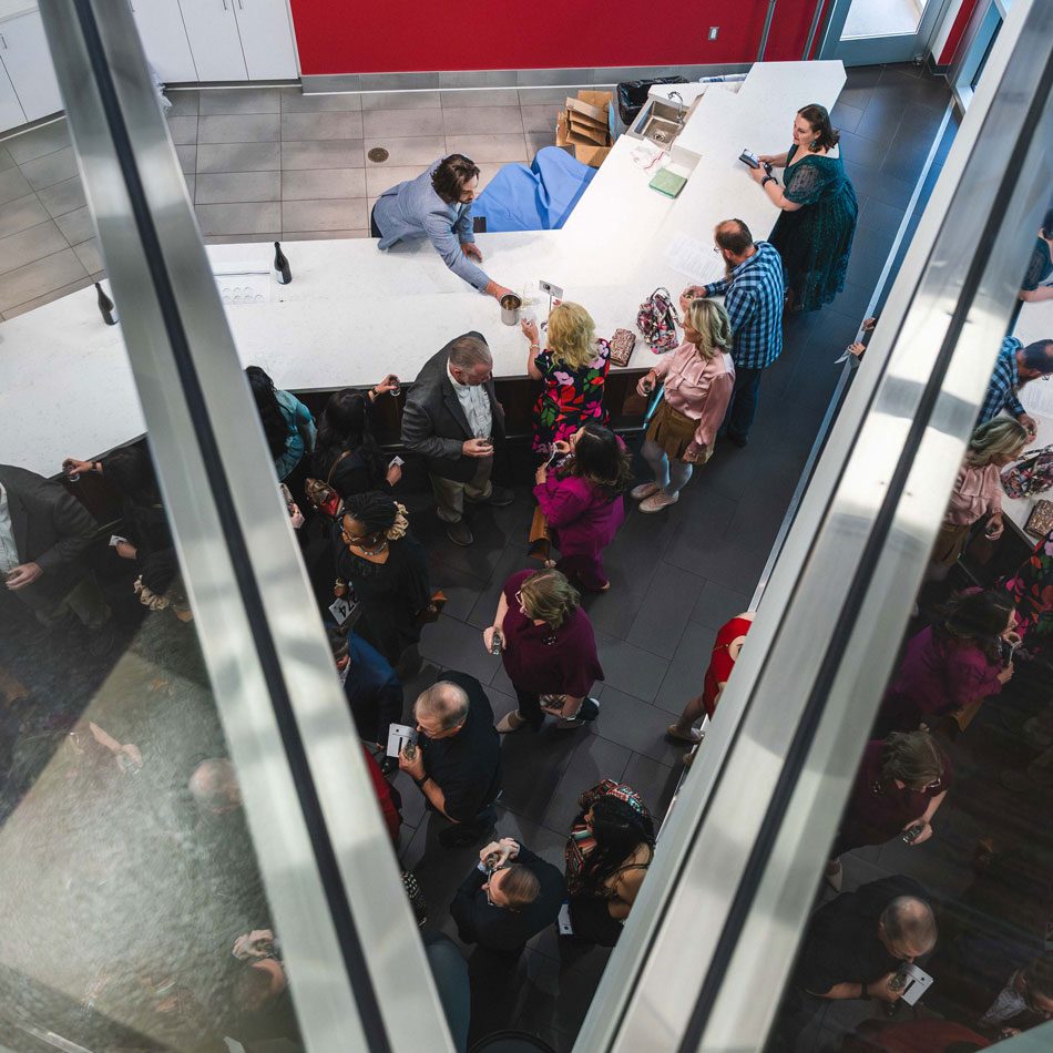 an overhead view of an event showing a crowd on the floor from high above