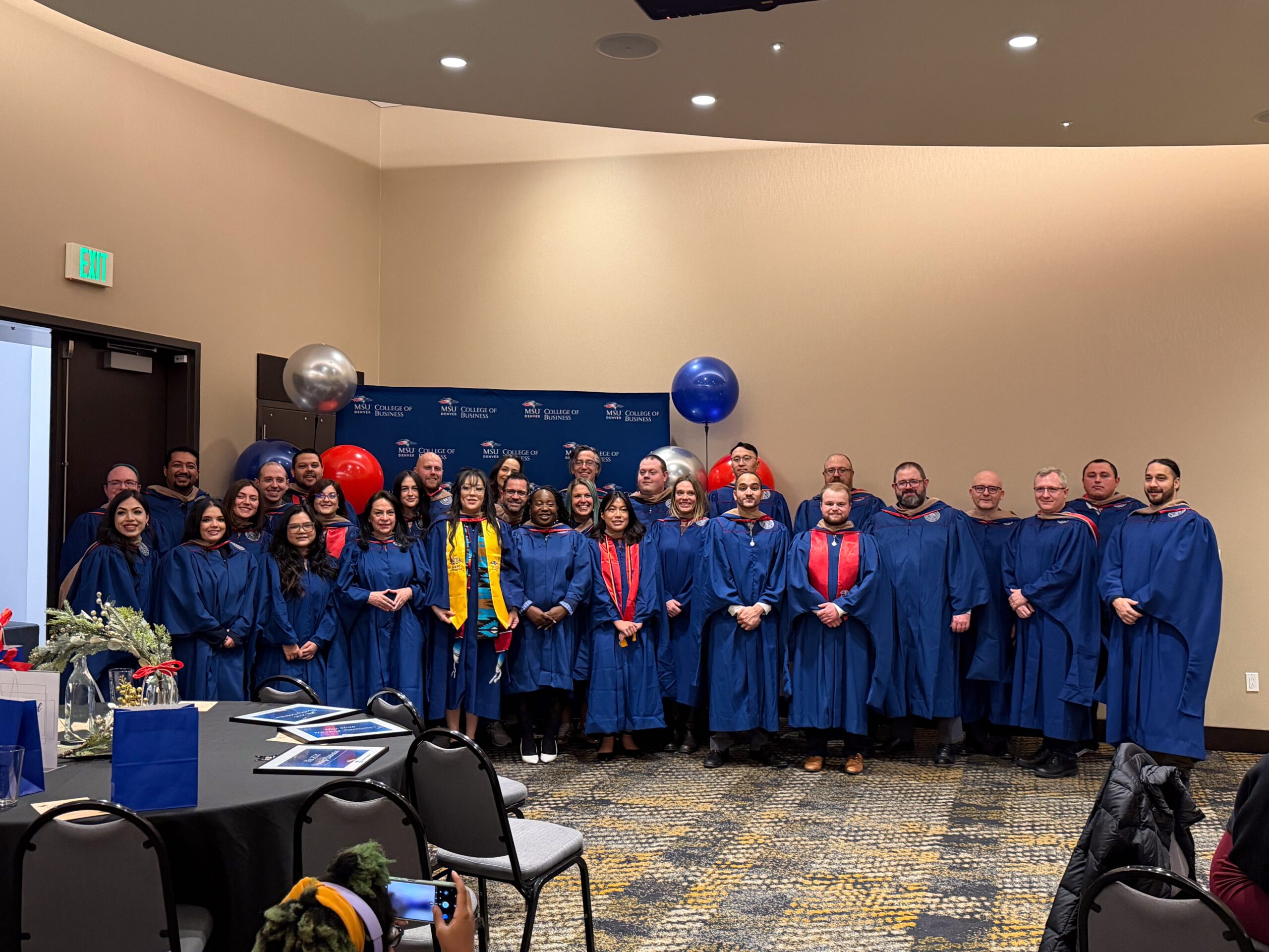 Fall '25 MBa & MPAcc Hooding Celebration - group photo of all grads in regalia