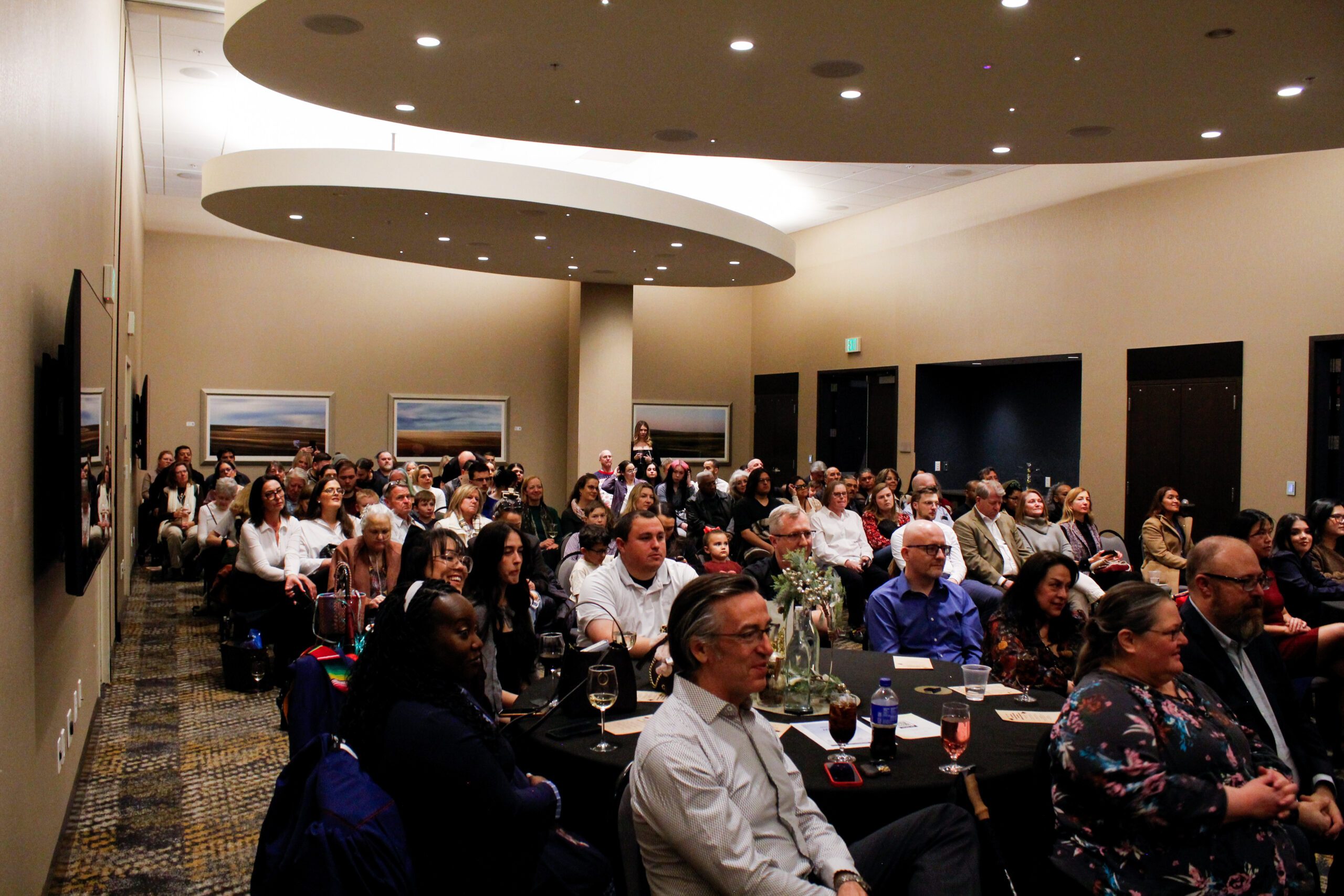 Fall '25 MBA & MPAcc Hooding Celebration - looking out at attendees, packed room