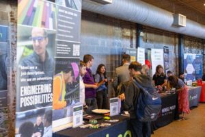 Person at table getting information on jobs.