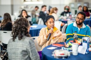 3 students at a table.