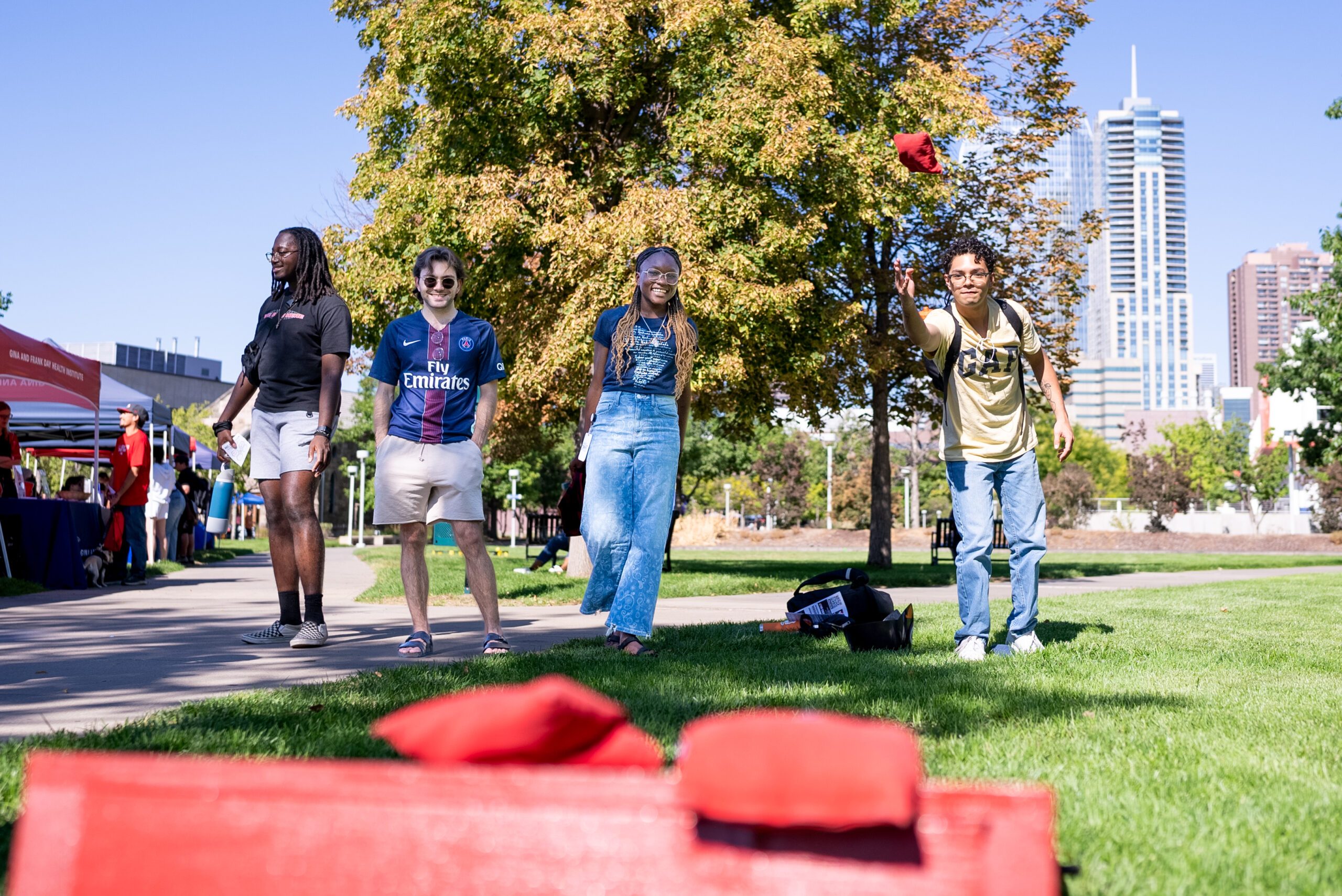 Students playing corn hole.