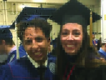 Two graduates with caps on