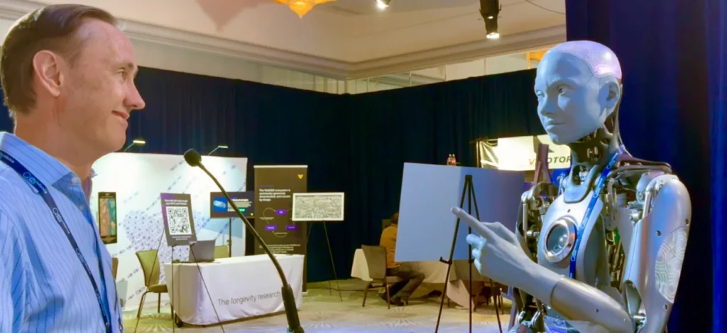 Steve Jurvetson talking to an android with a human-styled face
