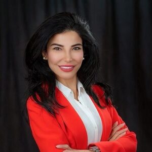 Headshot of Hediyeh Arasteh in a red suit.