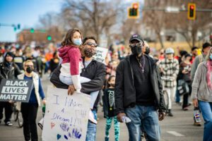People walking in the street for a parade.