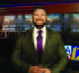 Man in a suit and tie smiles for the camera