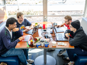 Four MSU Denver students sitting at a table preparing for final exams