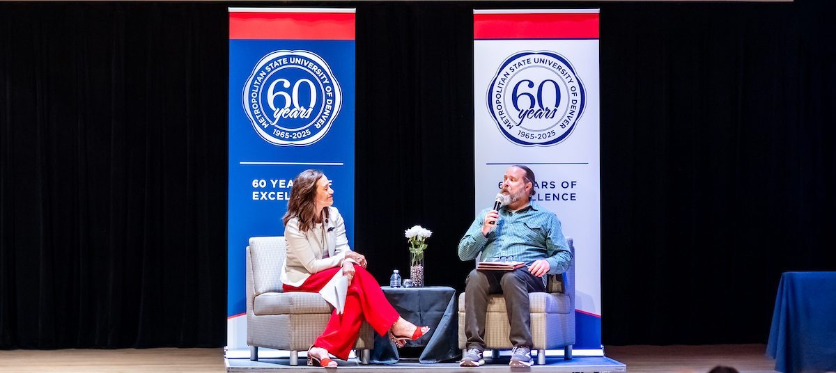 Provost Matthew S. Makley, Ph.D. and President Janine Davidson, Ph.D. speaking on stage.