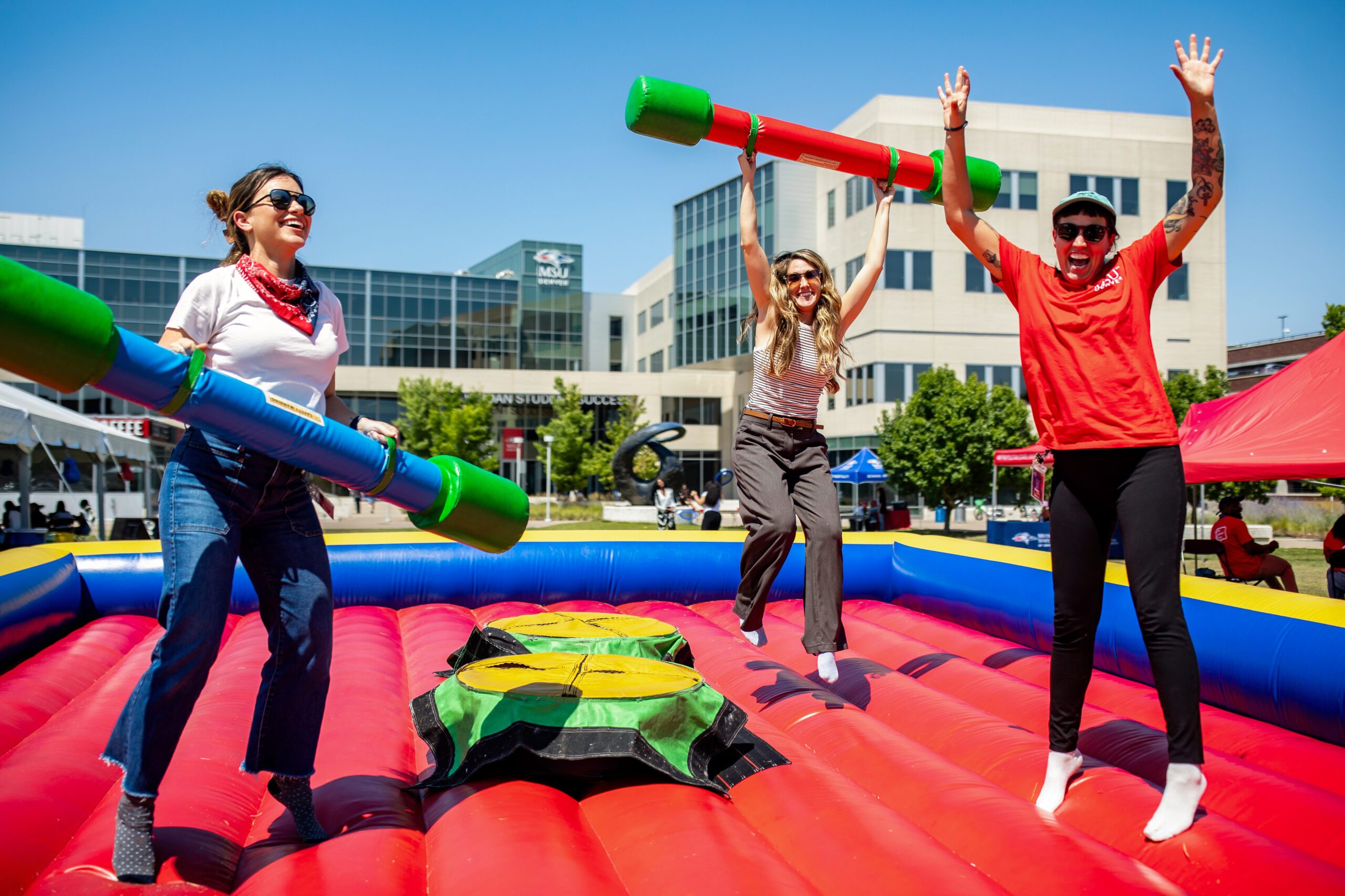 Students outside jumping.
