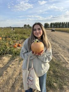 Photo of Isabella with a pumpkin