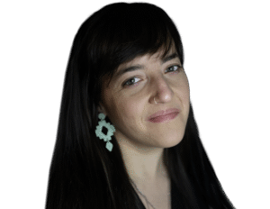 Woman with black long hair and bangs with light blue earrings