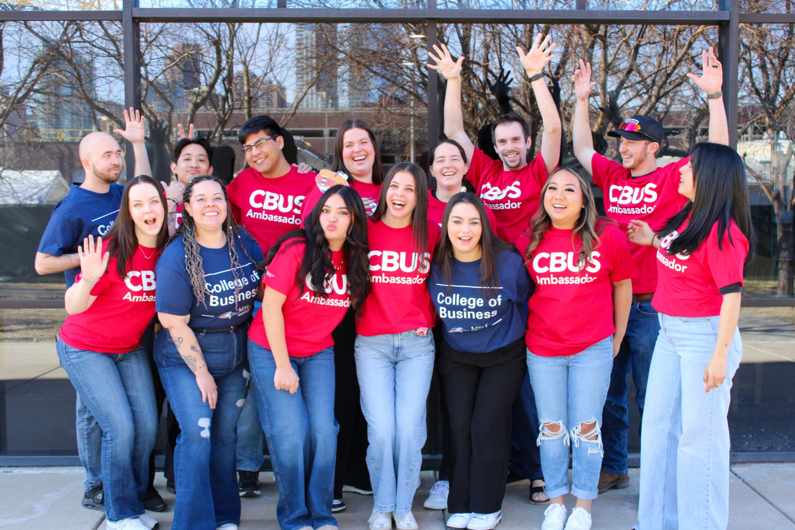 A group of students smiling and acting funny