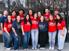 A group of students smiling and acting funny