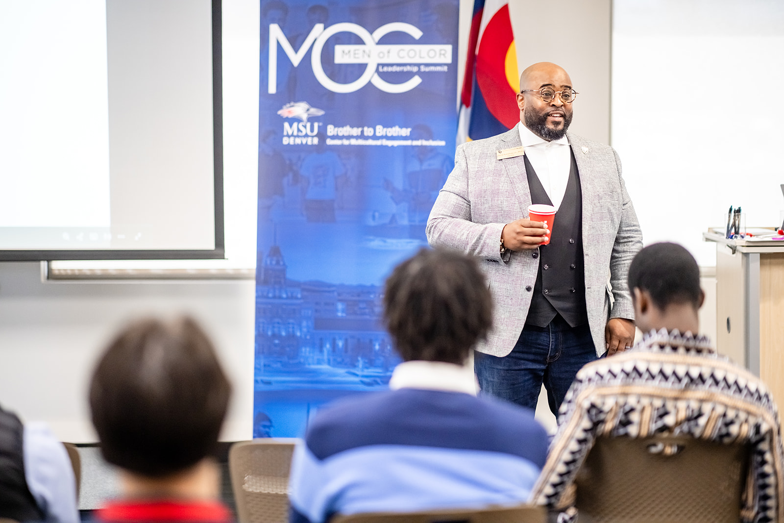 Presenter discussing topic to students