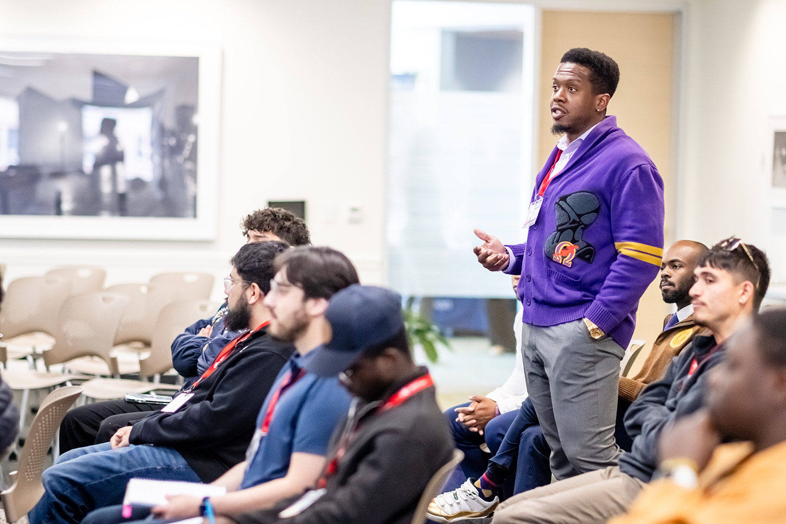 Student standing asking a question