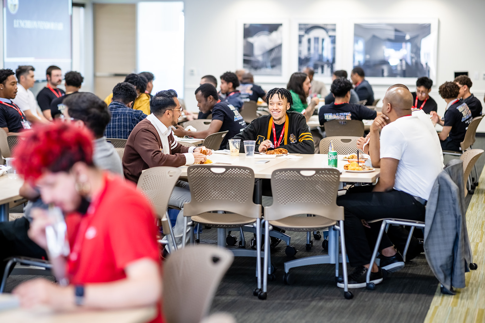 Students discussing at a table during event