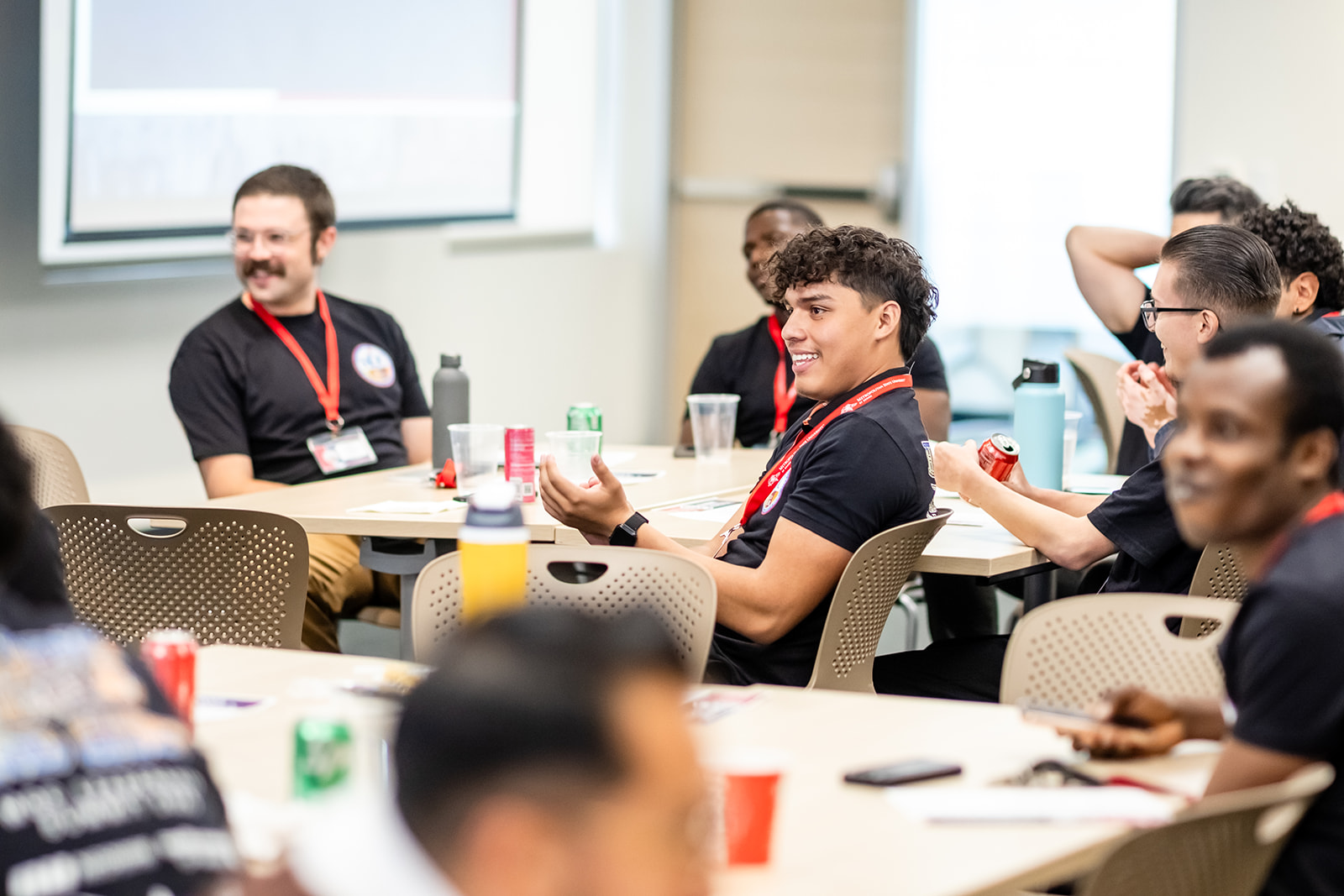 Students smiling and engaging during a presentation
