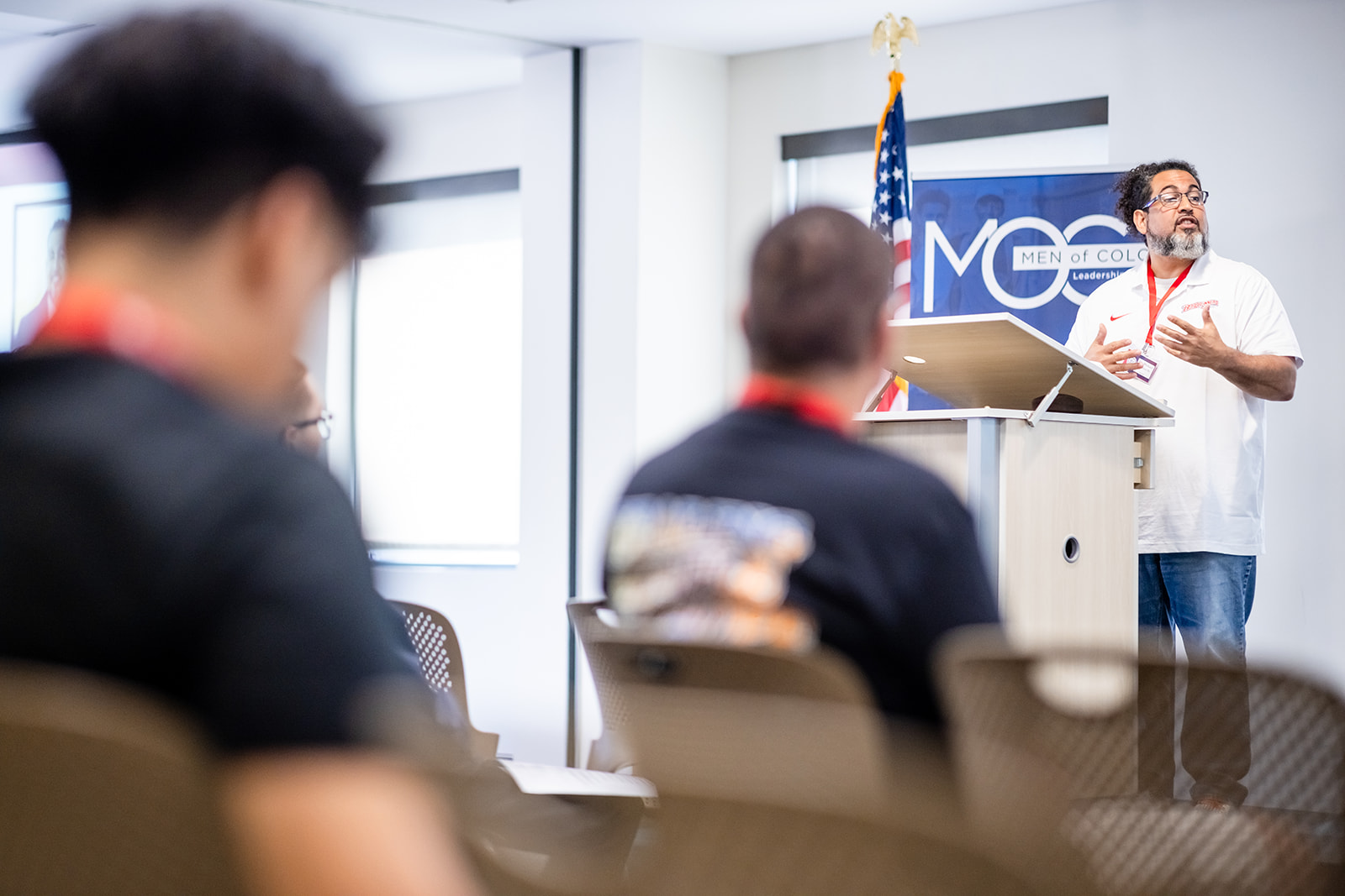 Presenter discussing amongst students