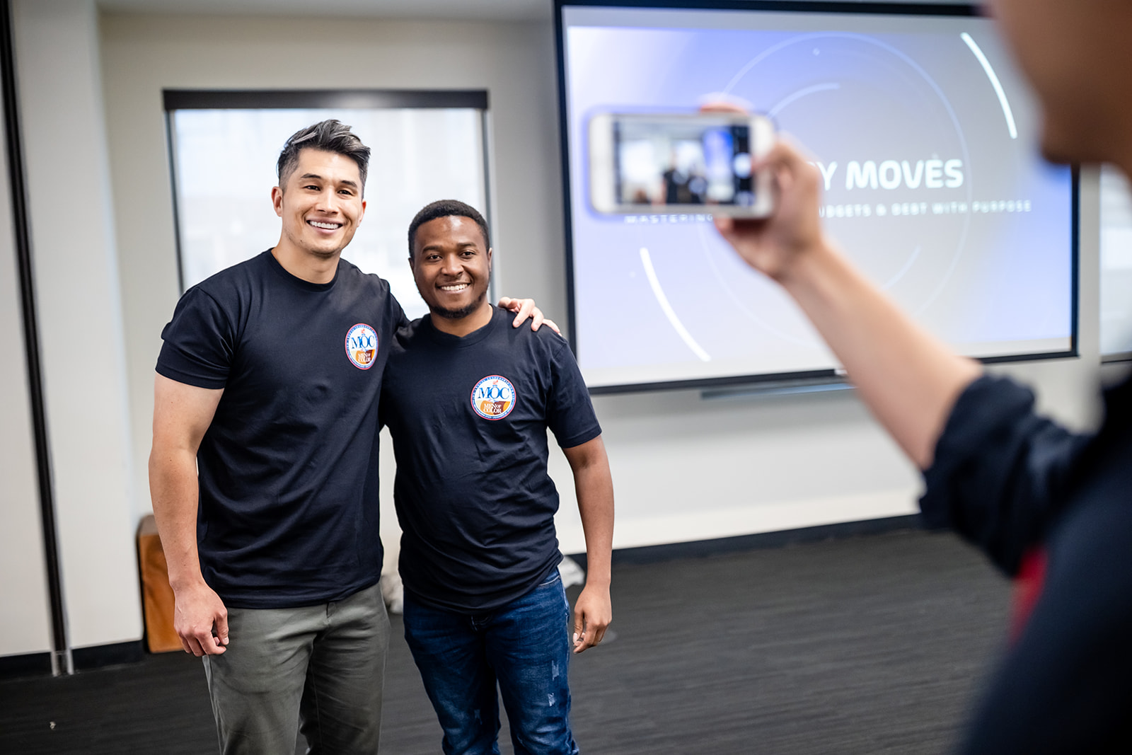 Student and presenter taking a photo