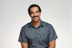 picture of sir ramsey in a grey button up