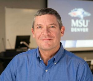 Man wearing blue shirt.