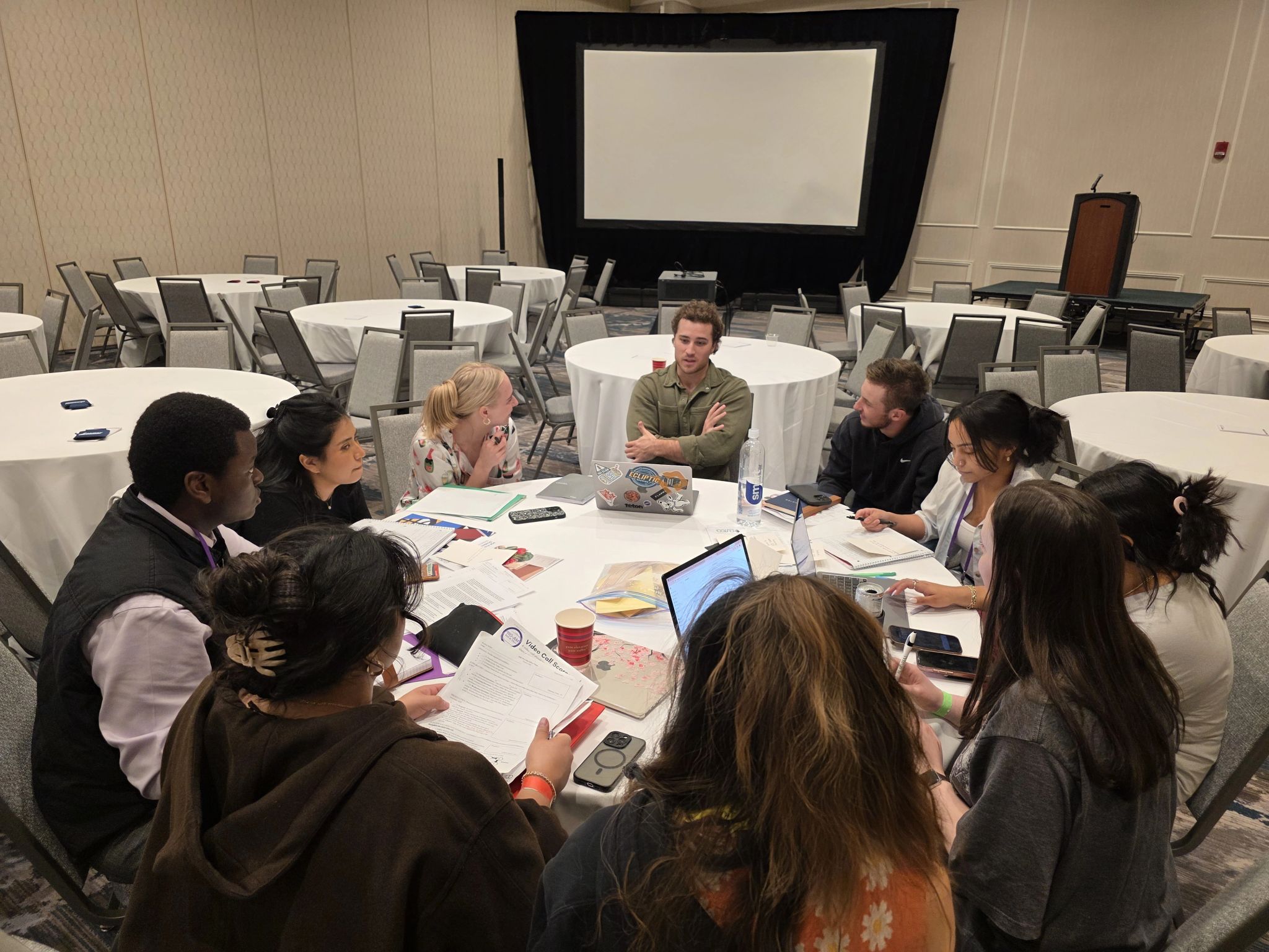 A group of MSU Denver Students sitting around a table talking