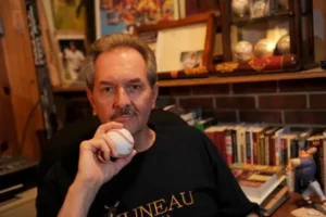 Man holds a baseball