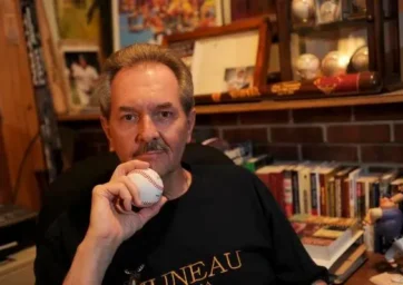 Man holds a baseball