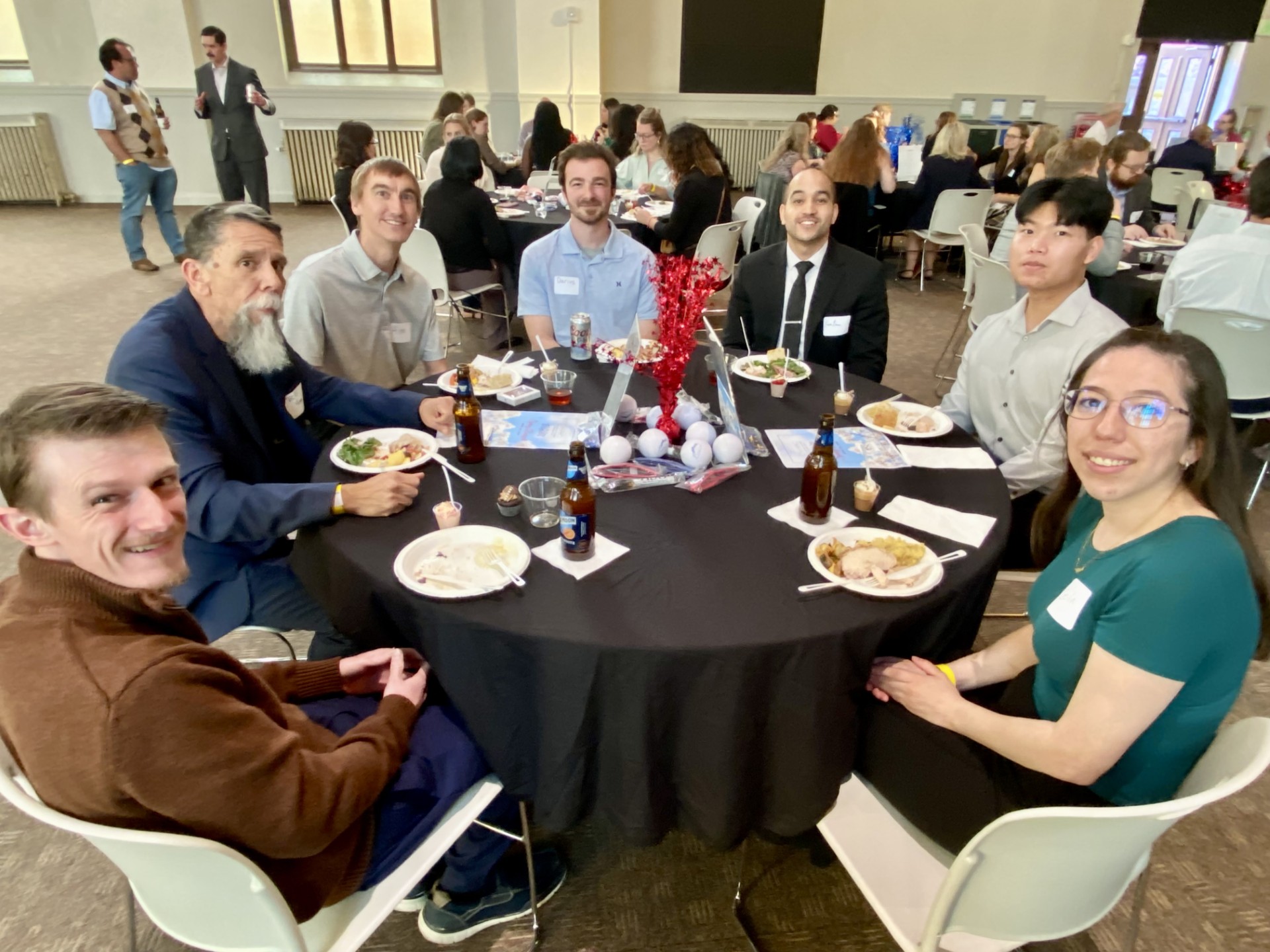 6 MPAcc students & 1 faculty sitting at a table at the Spring '26 ASO Banquet